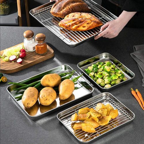 Chickens, potatoes and other veggies are prepared on the baking tray