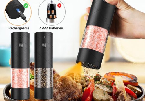 The image showcases electric salt and pepper grinders. One grinder is held over a plate of cooked food, dispensing ground pepper. Two other grinders stand beside the plate, one filled with pink Himalayan salt and the other with black peppercorns. Inset diagrams highlight that the grinders are rechargeable via USB and can also be powered by 6 AAA batteries.