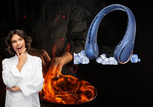 The image shows a woman in a white chef's coat looking towards a blue portable neck fan. In the background, there's a cooking scene with flames.